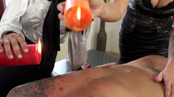 Two Sexy Dommes Torture Dude With Wax Screencap 16 on www.sinx.com