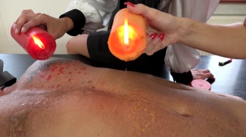 Two Sexy Dommes Torture Dude With Wax Screencap 19 on www.sinx.com
