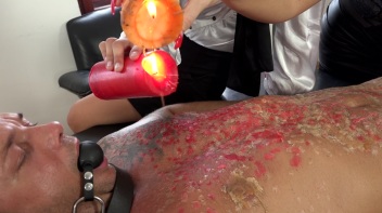 Two Sexy Dommes Torture Dude With Wax Screencap 35 on www.sinx.com