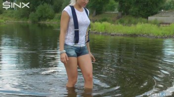 Seductive Blonde Smokes And Gets Drenched In Lake Screencap 19 on www.sinx.com
