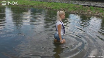 Seductive Blonde Smokes And Gets Drenched In Lake Screencap 20 on www.sinx.com