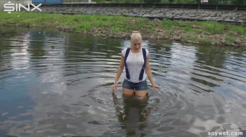 Seductive Blonde Smokes And Gets Drenched In Lake Screencap 21 on www.sinx.com