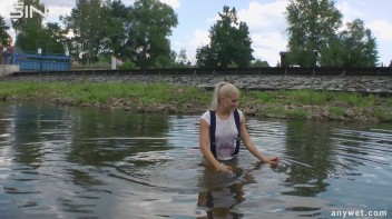 Seductive Blonde Smokes And Gets Drenched In Lake Screencap 22 on www.sinx.com