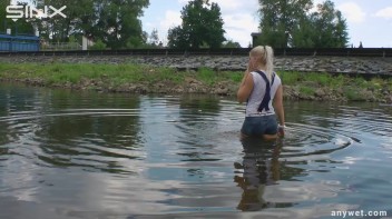 Seductive Blonde Smokes And Gets Drenched In Lake Screencap 23 on www.sinx.com