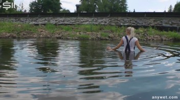 Seductive Blonde Smokes And Gets Drenched In Lake Screencap 25 on www.sinx.com