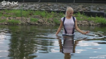 Seductive Blonde Smokes And Gets Drenched In Lake Screencap 26 on www.sinx.com