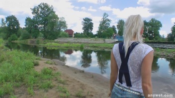 Seductive Blonde Smokes And Gets Drenched In Lake Screencap 4 on www.sinx.com