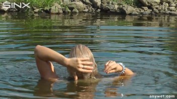 Seductive Blonde Smokes And Gets Drenched In Lake Screencap 43 on www.sinx.com