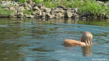 Seductive Blonde Smokes And Gets Drenched In Lake Screencap 45 on www.sinx.com