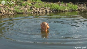 Seductive Blonde Smokes And Gets Drenched In Lake Screencap 53 on www.sinx.com
