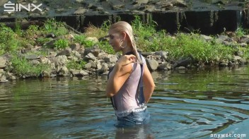 Seductive Blonde Smokes And Gets Drenched In Lake Screencap 54 on www.sinx.com