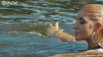 Seductive Blonde Smokes And Gets Drenched In Lake Screencap 56 on www.sinx.com