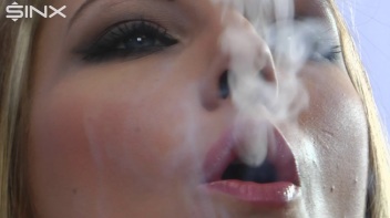 Sexy Blonde Wraps Her Lips Around A Cigarette Screencap 23 on www.sinx.com