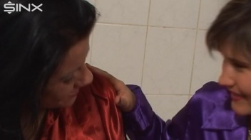 Slippery Clothed Bathtub Fun For Lesbians Screencap 7 on www.sinx.com