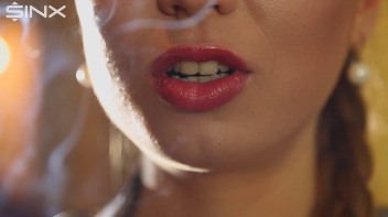Beautiful Brunette Smiles While Enjoying A Cigarette Screencap 4 on www.sinx.com