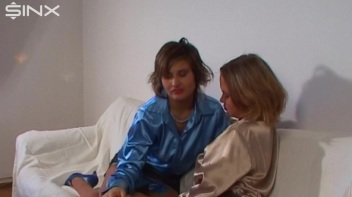 Kinky Lesbians Kiss And Tease On Sofa Screencap 5 on www.sinx.com