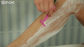 Fully Clothed Blonde Shaves Her Long Legs Screencap 17 on www.sinx.com