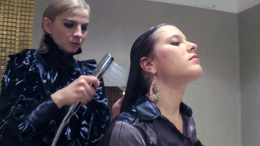 Latest deal - Blonde and brunette shampooing one another