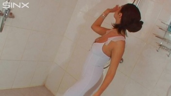 Brunette In White Dress Seductively Showers Screencap 3 on www.sinx.com