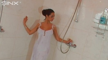 Brunette In White Dress Seductively Showers Screencap 5 on www.sinx.com