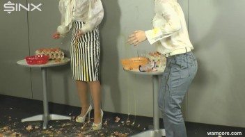 Playful businesswomen cover each other in raw egg Screencap 8 on www.sinx.com