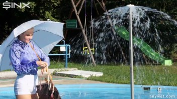 Playful Blonde Gets Drenched Under Water Fountain Screencap 12 on www.sinx.com