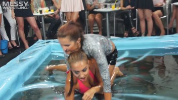 Messy Wrestling: Swimsuit vs. Short Shorts -  Shiny, Oily Smackdown! Screencap 21 on www.sinx.com