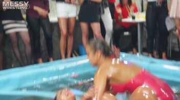 Messy Wrestling: Swimsuit vs. Short Shorts -  Shiny, Oily Smackdown! Screencap 45 on www.sinx.com