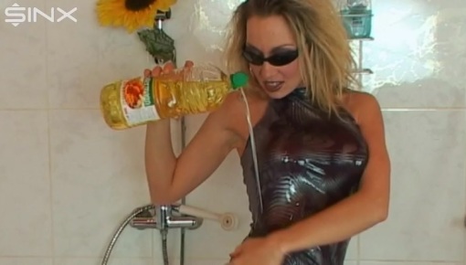 A sexy blonde in sunglasses is in the...