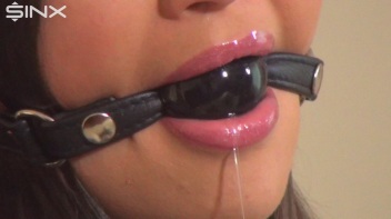 Ballgagged Brunette Drools Over Her Designer Clothes Screencap 1 on www.sinx.com