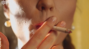 Beautiful Brunette Smiles While Enjoying A Cigarette Screencap 15 on www.sinx.com