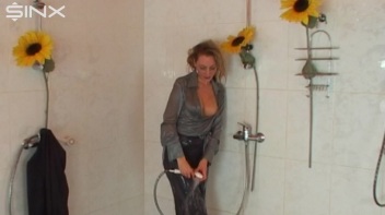 Busty Blonde Lathers Up In Clothed Shower Screencap 72 on www.sinx.com