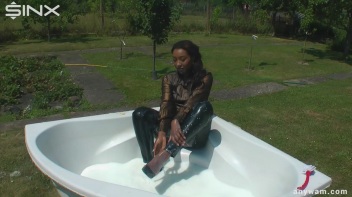 Ebony Hottie Bathes in Creamy Milk Screencap 13 on www.sinx.com