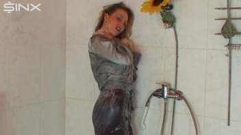 Busty Blonde Lathers Up In Clothed Shower Screencap 52 on www.sinx.com